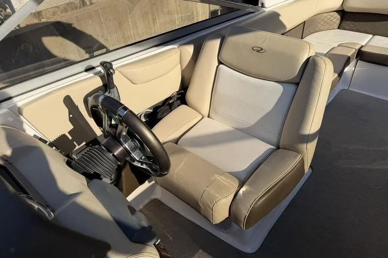 Slide: The Image of 2014 Regal 2700 ES Bowrider interior with beige seating and steering wheel. - 15