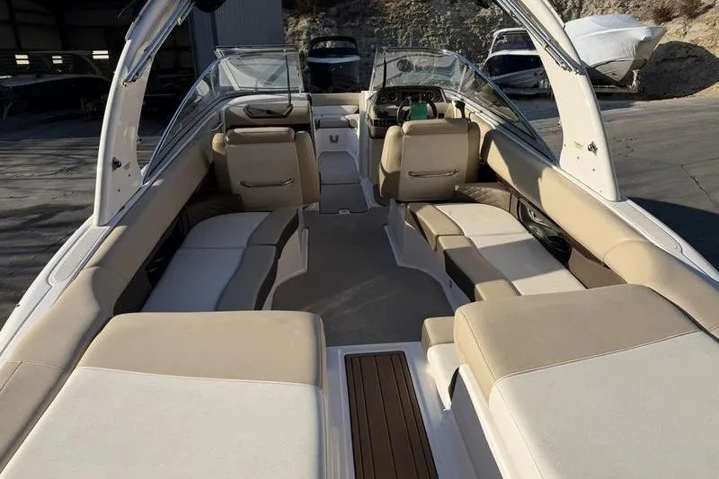 Slide: The Image of 2014 Regal 2700 ES Bowrider interior with beige seating and sleek design. - 23