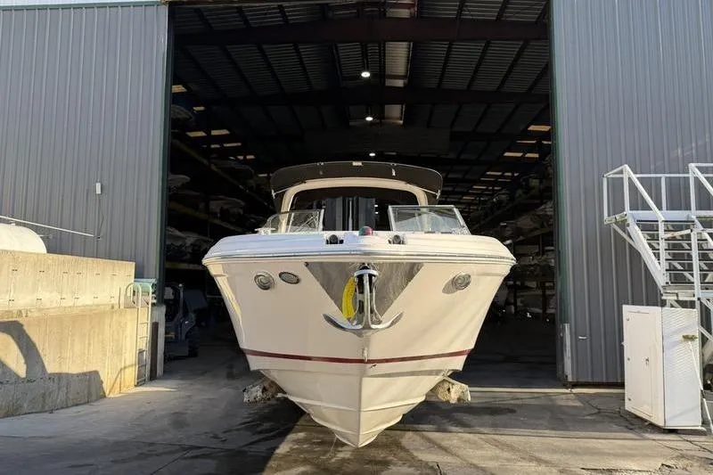 Slide: The Image of 2014 Regal 2700 ES Bowrider boat in storage facility, front view. - 7