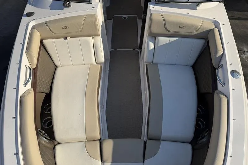 Slide: The Image of 2014 Regal 2700 ES Bowrider interior with beige and white seating. - 9