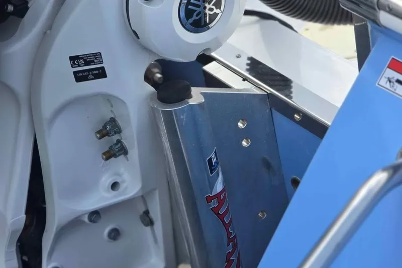 Slide: The Image of Close-up of 2023 Robalo 266 Cayman SD boat engine components and fittings. - 12