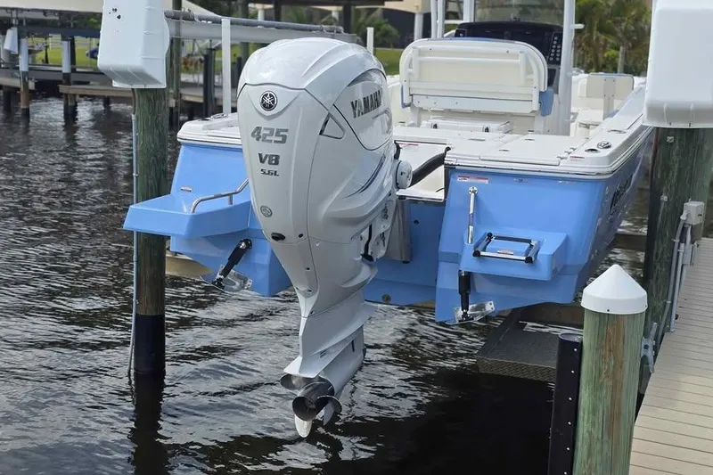 Slide: The Image of 2023 Robalo 266 Cayman SD with Yamaha 425 V8 engine at dockside. - 8