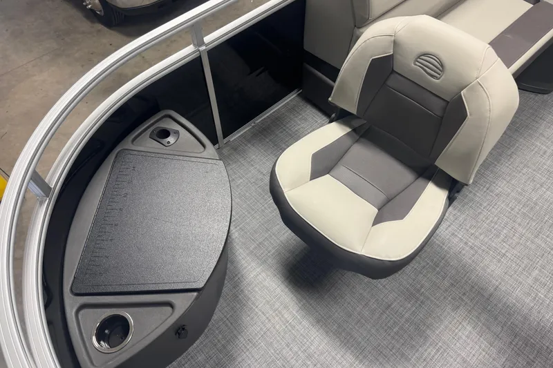 Slide: The Image of 2026 Sun Tracker Fishin' Barge 20 DLX interior with seating and fishing station. - 6