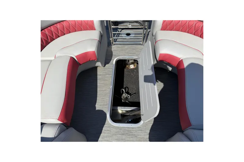 Slide: The Image of 2022 Bennington R 24 Quad Bench Bowrider interior with open storage compartment. - 22