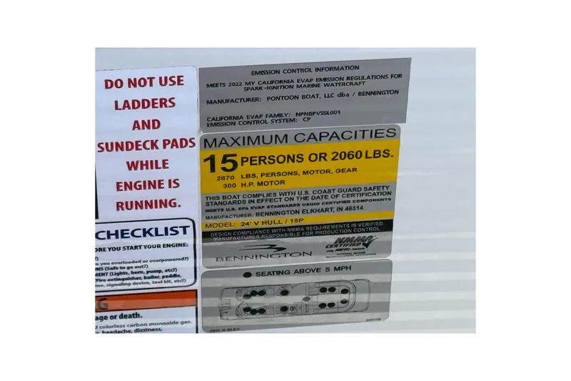 Slide: The Image of Bennington R 24 Quad Bench Bowrider 2022 capacity label, safety warnings, and checklist. - 24