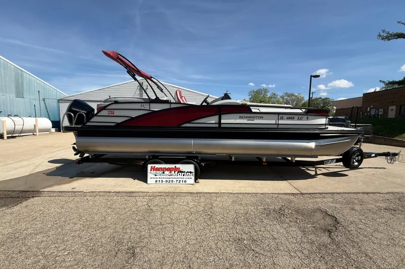 Slide: The Image of 2022 Bennington R 24 Quad Bench Bowrider pontoon boat on trailer at Hennepin Marine. - 25