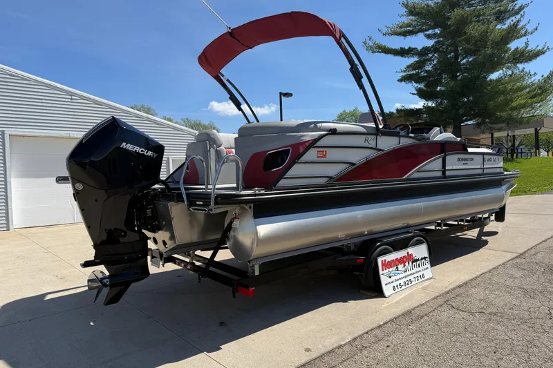 Slide: The Image of 2022 Bennington R 24 Quad Bench Bowrider with Mercury engine on trailer. - 7