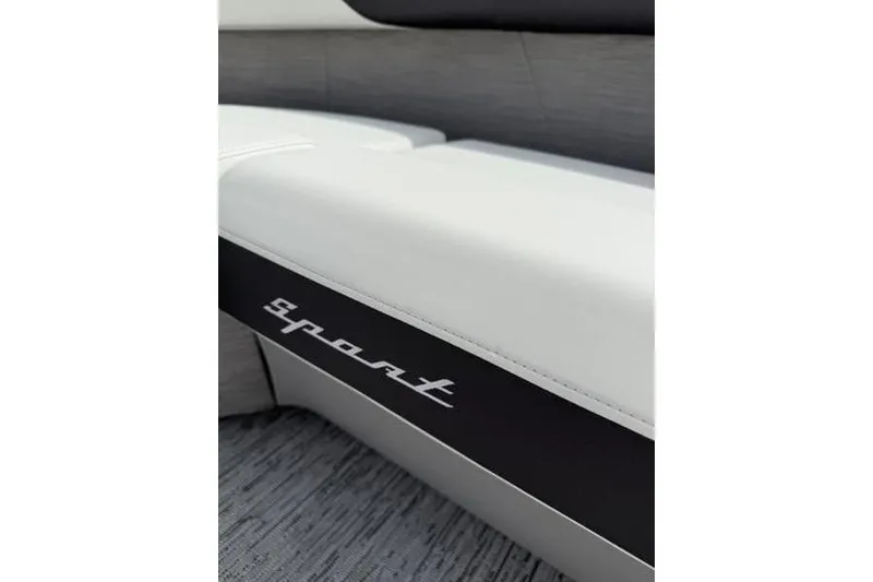 Slide: The Image of 2025 Bennington 26 MFB-SPT boat seat with "sport" logo, featuring sleek white and black design. - 11