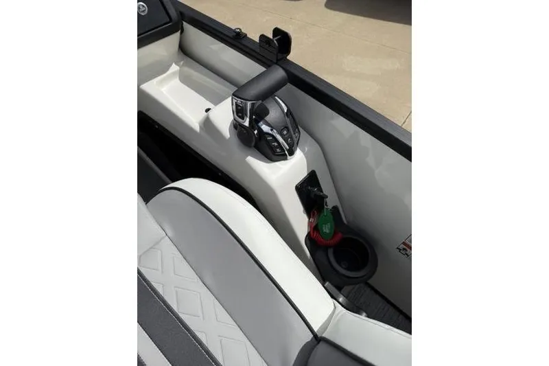 Slide: The Image of Interior view of 2025 Bennington 26 MFB-SPT boat, featuring control panel and seating. - 16