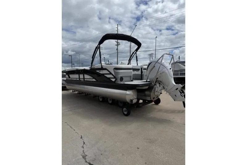 Slide: The Image of 2025 Bennington 26 MFB-SPT pontoon boat with canopy and outboard motor. - 6