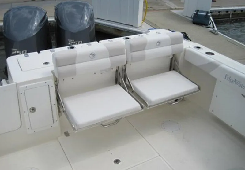 Slide: The Image of Manufacturer Provided Image: 2015 Edgewater 280CX Crossover boat with dual foldable seats and twin outboard motors. - 6