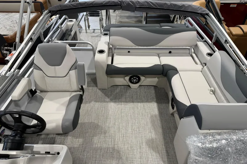 Slide: The Image of 2026 Avalon 2185 VENTURE 85 VRB boat interior with gray seating and steering wheel. - 11