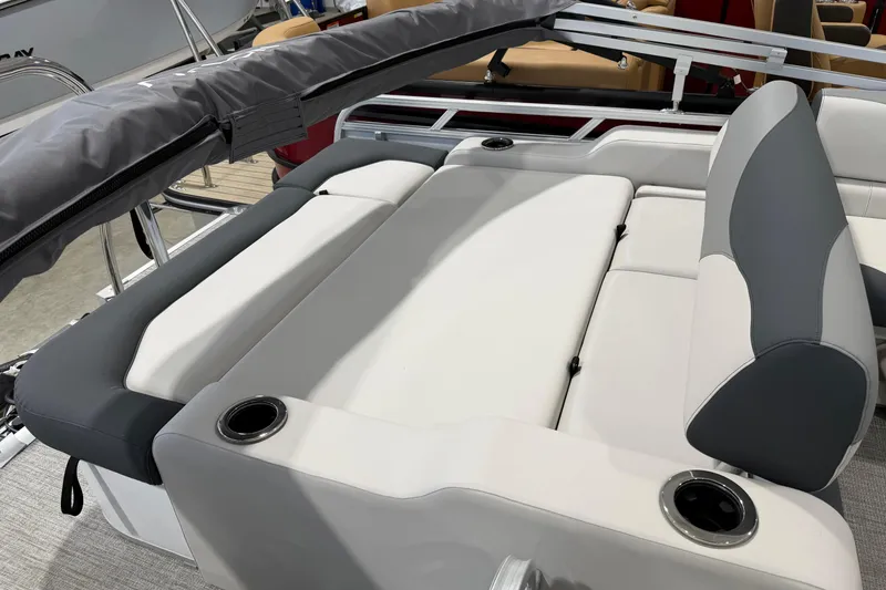 Slide: The Image of 2026 Avalon 2185 VENTURE 85 VRB boat interior with cushioned seating and cup holders. - 15