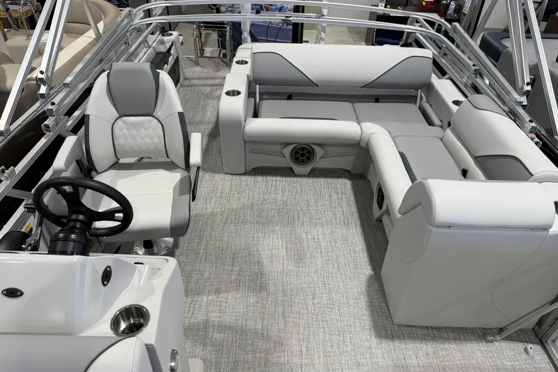 Slide: The Image of 2026 Avalon 2185 VENTURE 85 VRB boat interior with plush seating and modern steering console. - 4