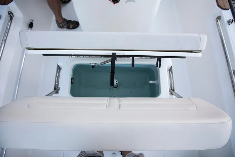 Slide: The Image of Manufacturer Provided Image: 2026 Boston Whaler 170 Montauk boat interior with open storage compartment. - 27