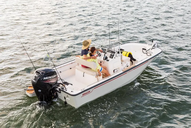 Slide: The Image of Manufacturer Provided Image: 2026 Boston Whaler 170 Montauk boat on water with passengers and fishing gear. - 6
