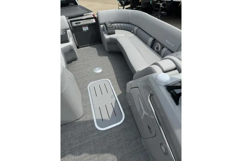 Slide: The Image of 2025 Bennington 27 QXFBAT2 boat interior with gray seating and flooring. - 13