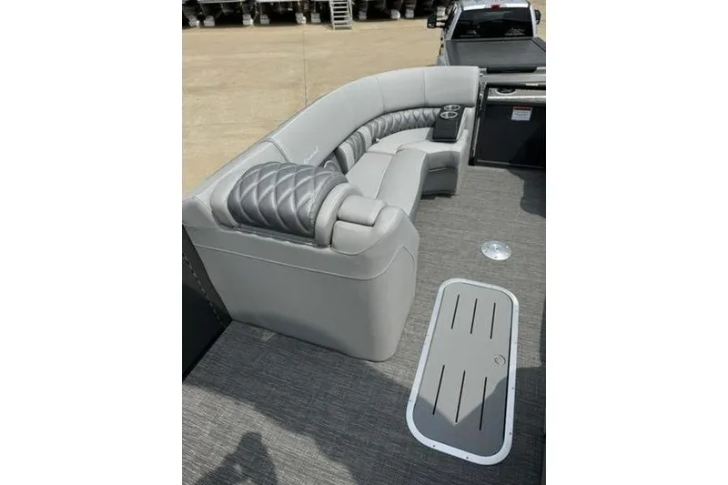 Slide: The Image of 2025 Bennington 27 QXFBAT2 boat interior with luxurious gray seating and modern design. - 14