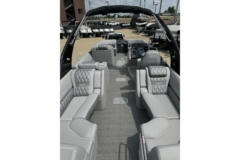 Slide: The Image of Luxurious interior of 2025 Bennington 27 QXFBAT2 pontoon boat with plush seating. - 18