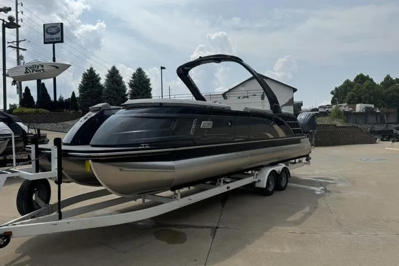 Slide: The Image of 2025 Bennington 27 QXFBAT2 pontoon boat on trailer at dealership. - 5