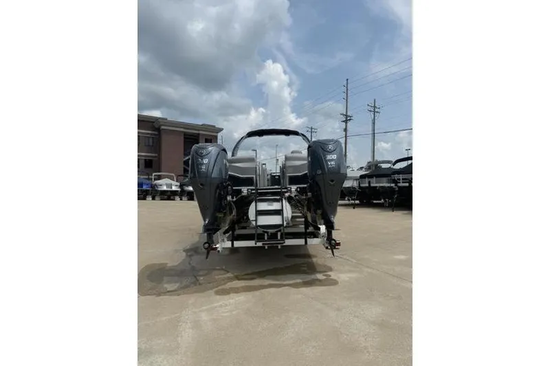 Slide: The Image of 2025 Bennington 27 QXFBAT2 boat with dual outboard motors on display. - 6