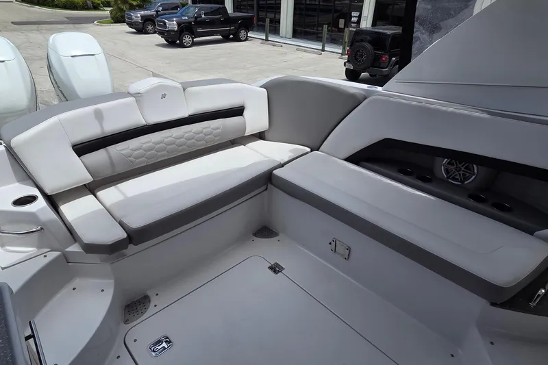Slide: The Image of 2019 Four Winns H350 OB boat interior with plush seating and modern design. - 11