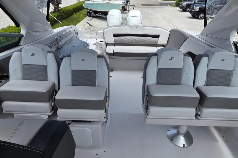 Slide: The Image of 2019 Four Winns H350 OB boat interior with luxurious seating and modern design. - 12