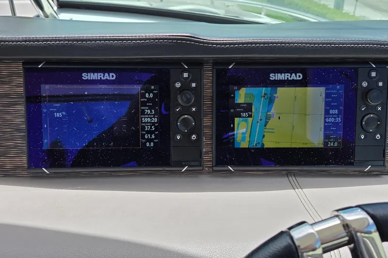 Slide: The Image of Simrad navigation displays on 2019 Four Winns H350 OB boat dashboard. - 22