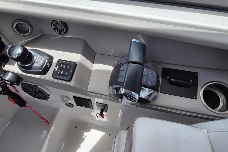 Slide: The Image of 2019 Four Winns H350 OB boat control panel with joystick and throttle. - 23