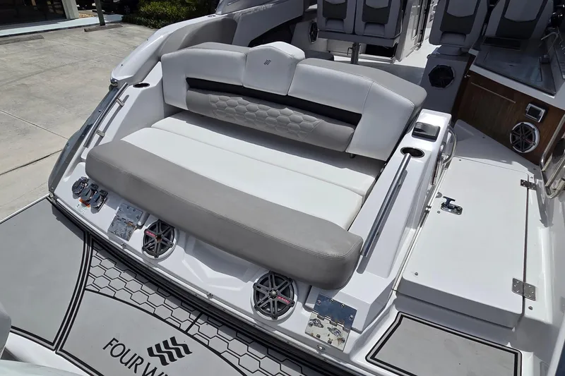 Slide: The Image of 2019 Four Winns H350 OB boat with spacious seating and modern design. - 26