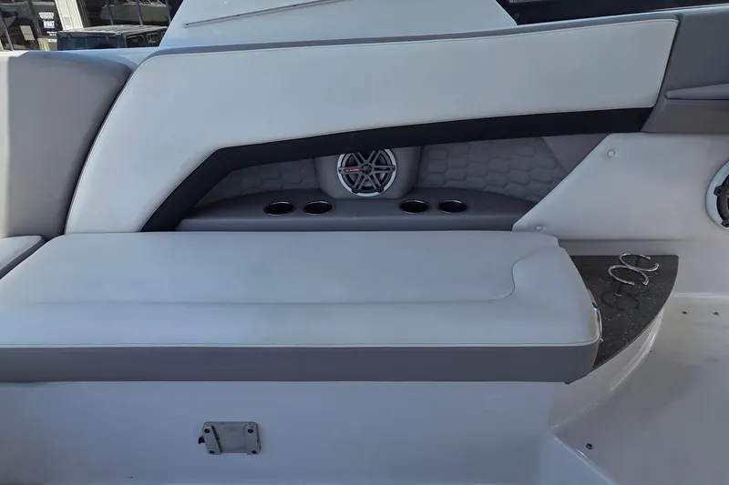 Slide: The Image of 2019 Four Winns H350 OB boat interior with cushioned seating and cup holders. - 28