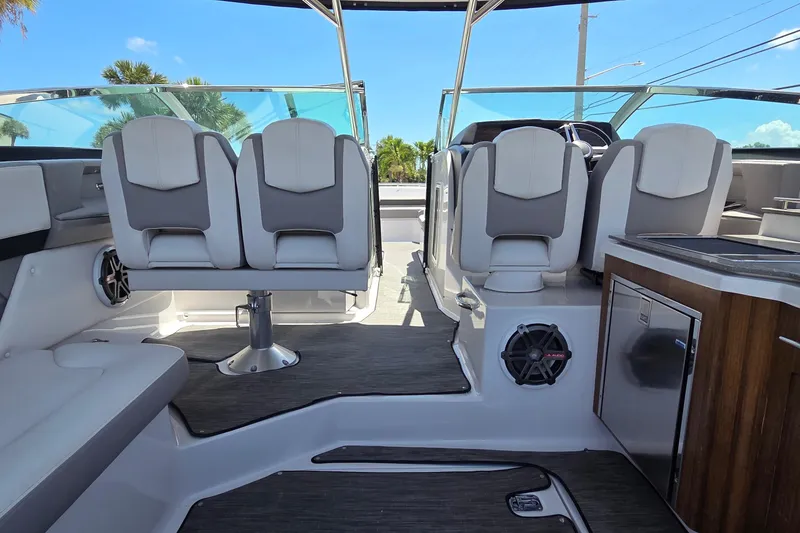 Slide: The Image of 2019 Four Winns H350 OB boat interior with modern seating and sleek design. - 31