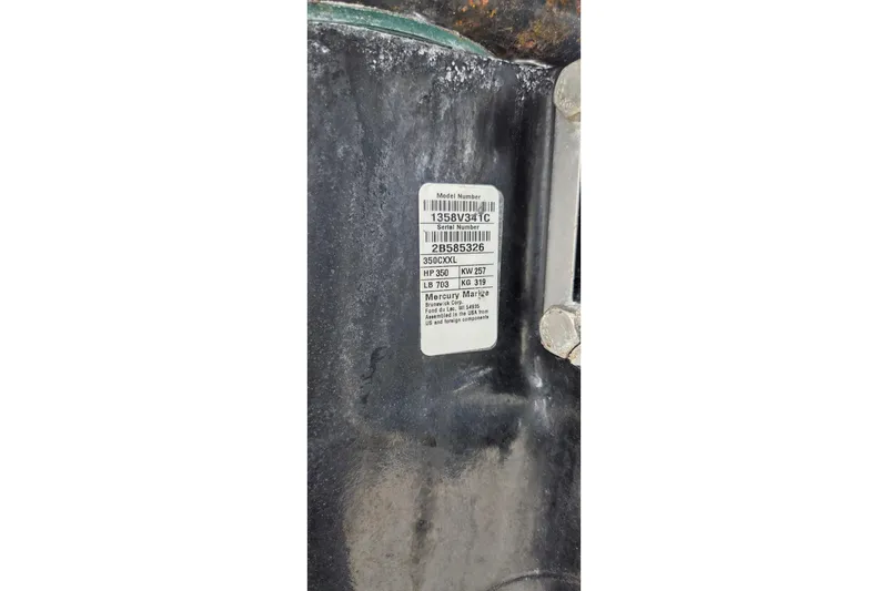Slide: The Image of Label on 2019 Four Winns H350 OB boat engine, displaying model and serial numbers. - 34
