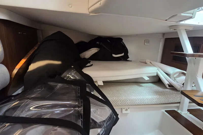 Slide: The Image of Interior cabin of 2019 Four Winns H350 OB boat with storage items. - 40