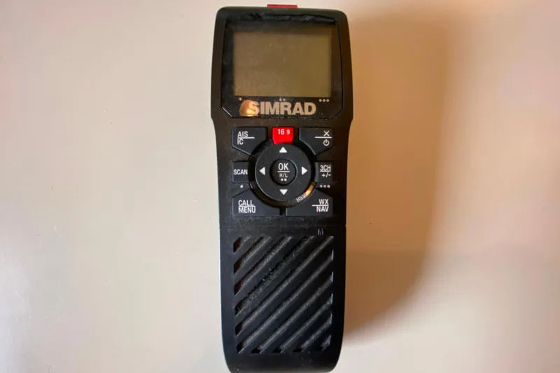 Slide: The Image of Simrad marine radio device with control buttons, suitable for Carver 28 Command Bridge 1991. - 31