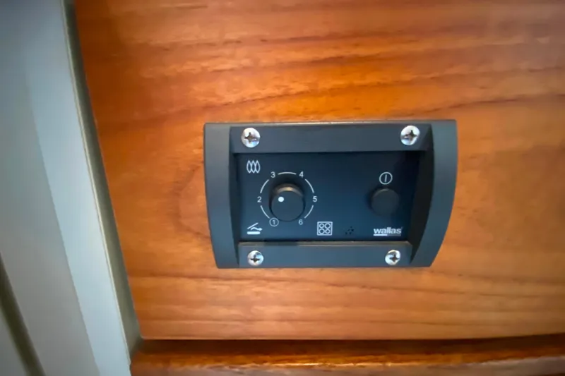 Slide: The Image of Control panel on 1991 Carver 28 Command Bridge boat, mounted on wooden surface. - 33
