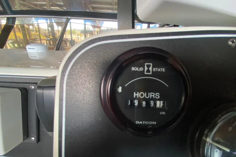 Slide: The Image of Hour meter on 1991 Carver 28 Command Bridge showing 1989 hours. - 47
