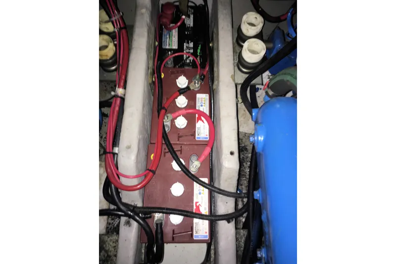 Slide: The Image of Battery compartment of a 1991 Carver 28 Command Bridge boat with wiring connections. - 50