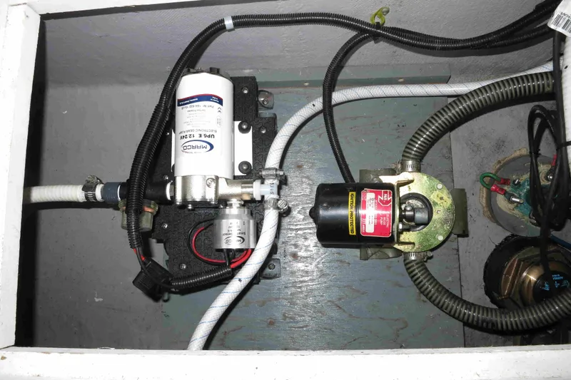 Slide: The Image of Electrical components in a 1991 Carver 28 Command Bridge boat engine compartment. - 57