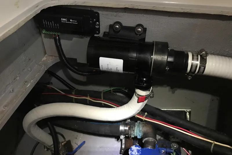 Slide: The Image of 1991 Carver 28 Command Bridge plumbing and wiring system detail. - 58