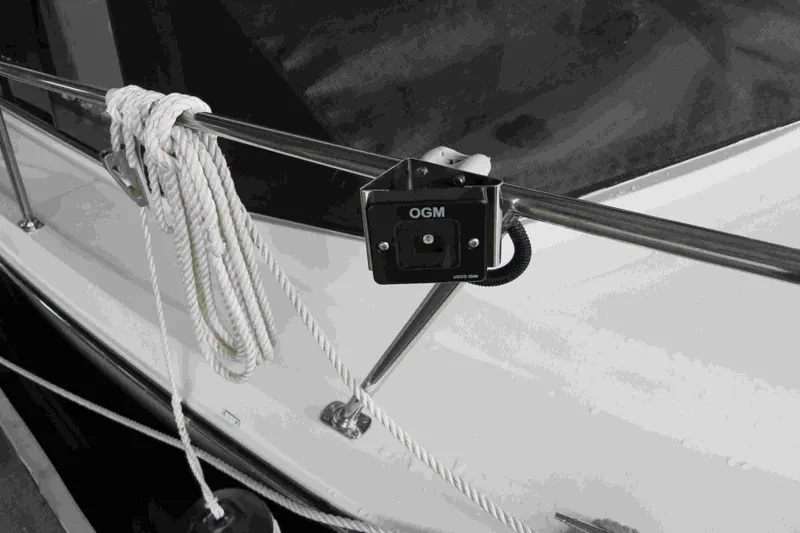 Slide: The Image of 1991 Carver 28 Command Bridge with OGM light and coiled rope on deck railing. - 66