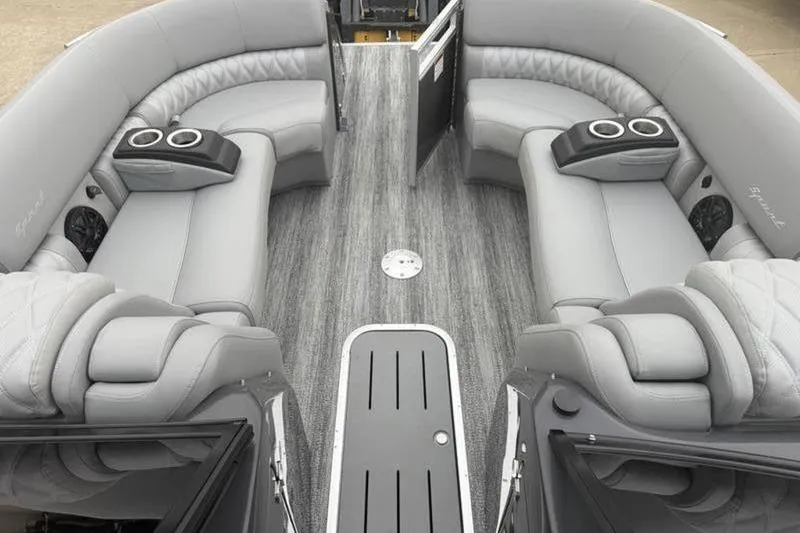 Slide: The Image of Luxurious interior of 2026 Bennington 25 QFBWA pontoon boat with plush seating and cup holders. - 12