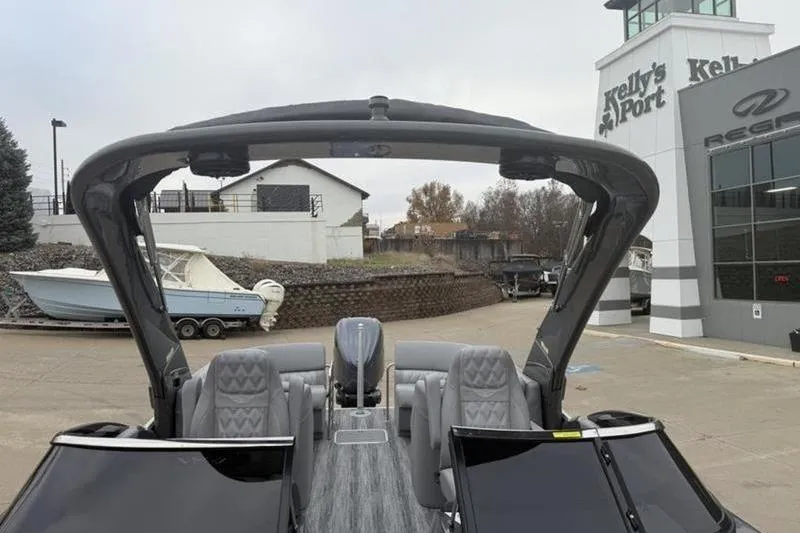 Slide: The Image of 2026 Bennington 25 QFBWA boat at dealership, featuring sleek design and modern seating. - 4