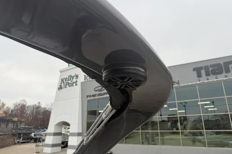 Slide: The Image of Close-up of a 2026 Bennington 25 QFBWA boat speaker at a dealership. - 5