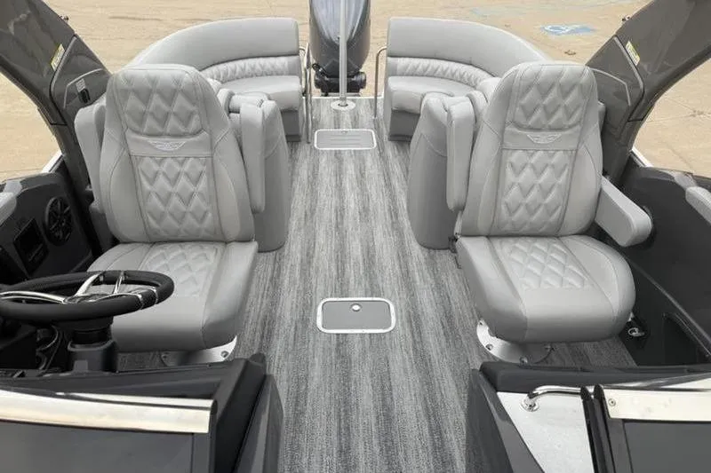 Slide: The Image of Luxurious interior of 2026 Bennington 25 QFBWA pontoon boat with plush seating. - 7