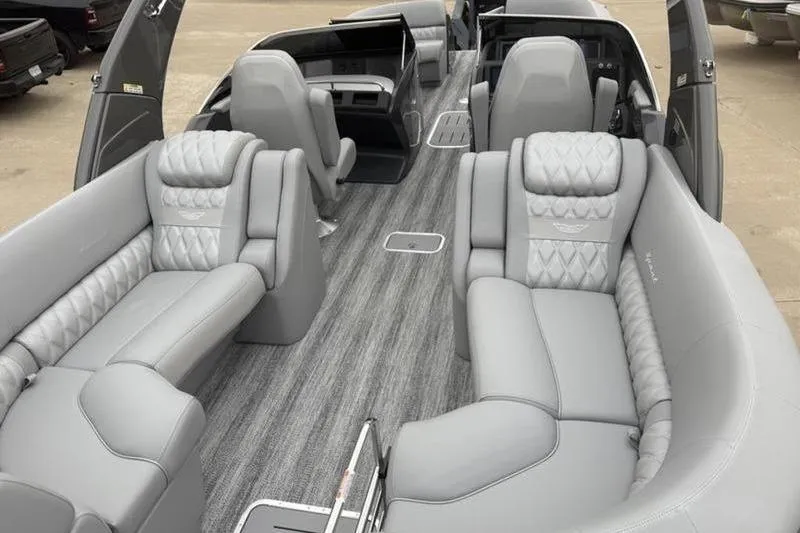 Slide: The Image of Luxurious interior of 2026 Bennington 25 QFBWA pontoon boat with plush gray seating. - 8