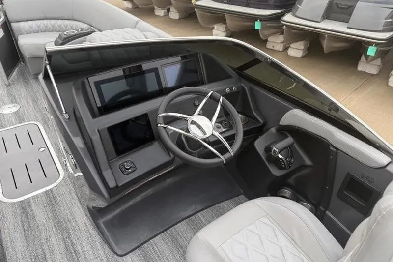 Slide: The Image of Helm of 2026 Bennington 25 QFBWA boat with modern steering and controls. - 9