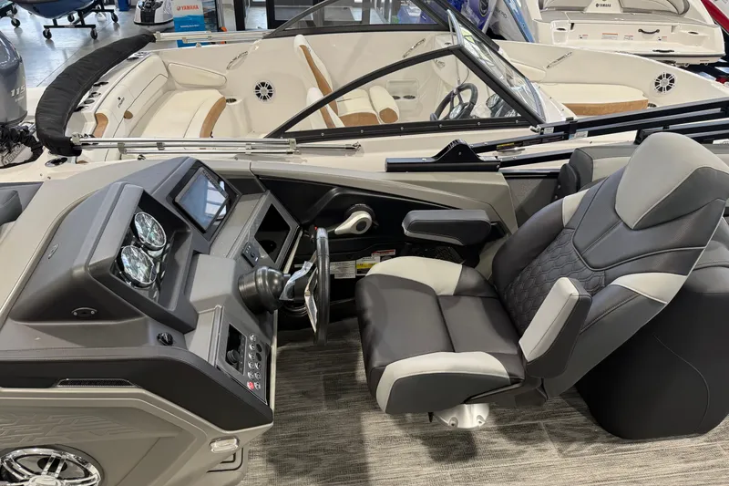 Slide: The Image of Interior view of 2026 Avalon 2585 25 Catalina QL boat with modern dashboard and seating. - 6