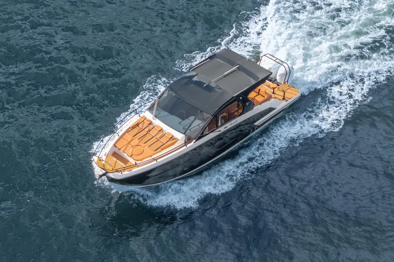 Slide: The Image of Aerial view of 2026 Hanover 387 boat cruising on open water. - 2