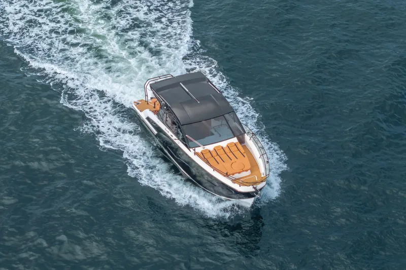Slide: The Image of Aerial view of 2026 Hanover 387 yacht cruising on open water. - 23